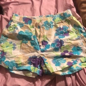 white shorts with purple,blue,green and tan design